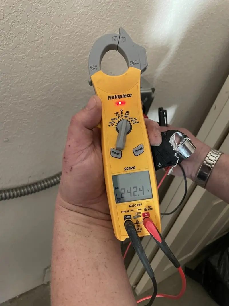 Voltage testing with clamp meter during Generator Installation in Laguna Vista